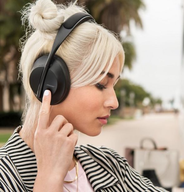 girl with headphones is listening to music