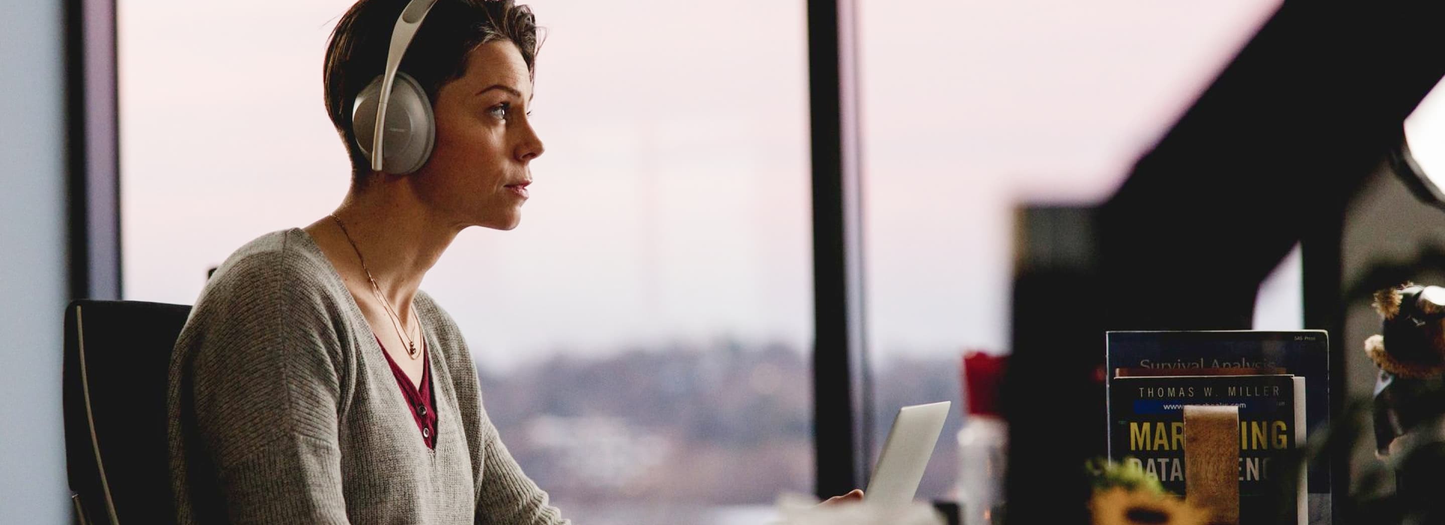 Woman in branded headphones works